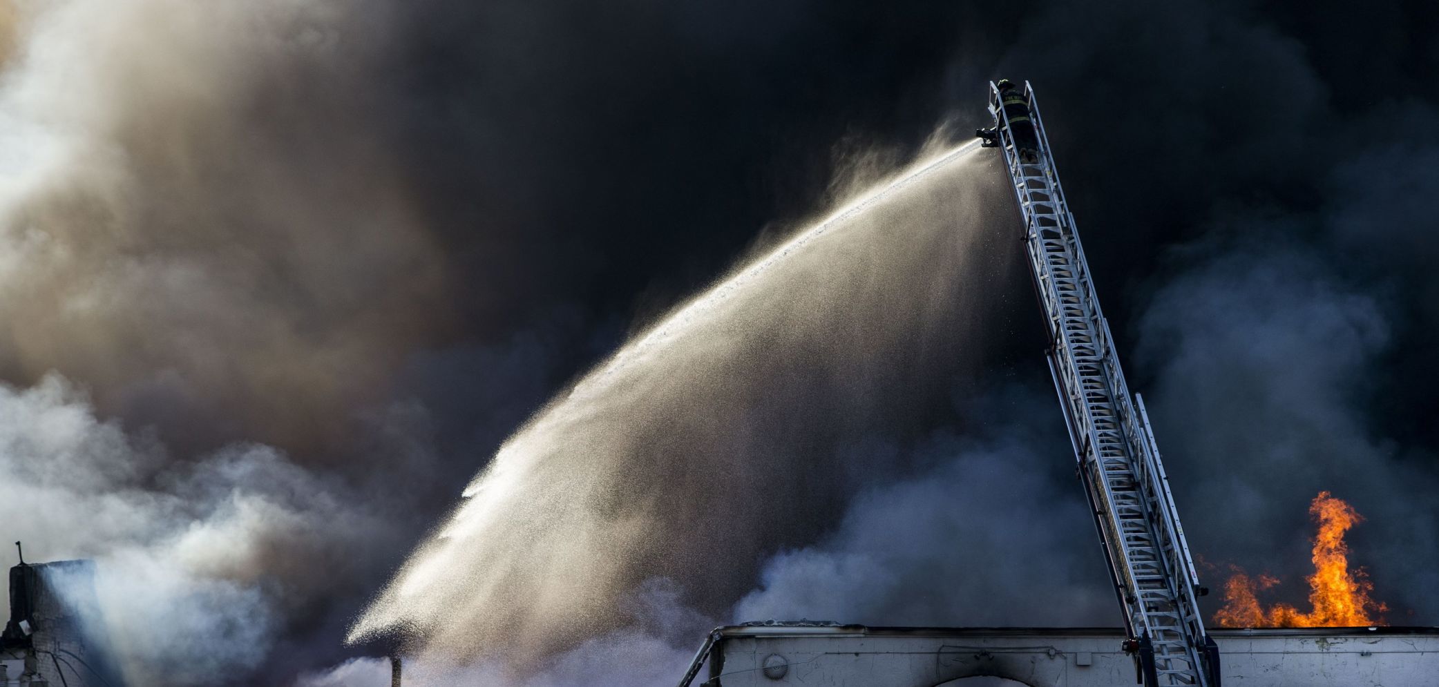 Large fire rolls through warehouse